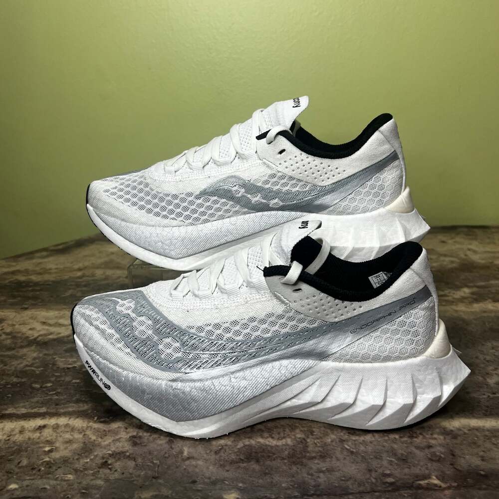 Saucony White Running Shoes with Black Collar and Silver Accents